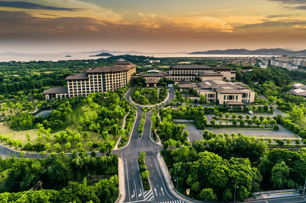 Aerial view of a large landscaped real estate development at sunset, representing a protected Texas real estate portfolio